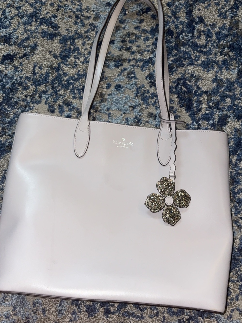kate spade light gray leather tote with floral charm